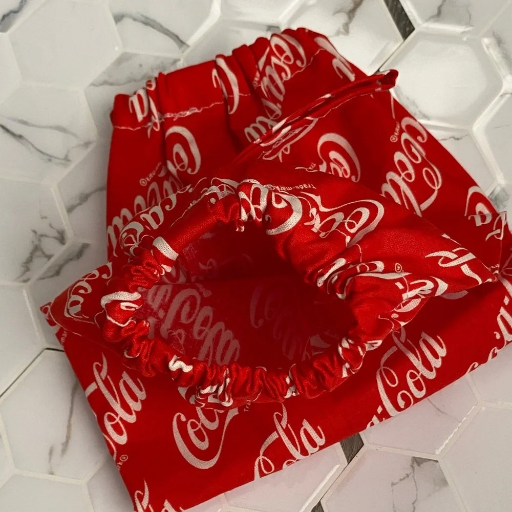 Handmade wall hanging grocery bags organizer and pantry with Coca Cola logo.